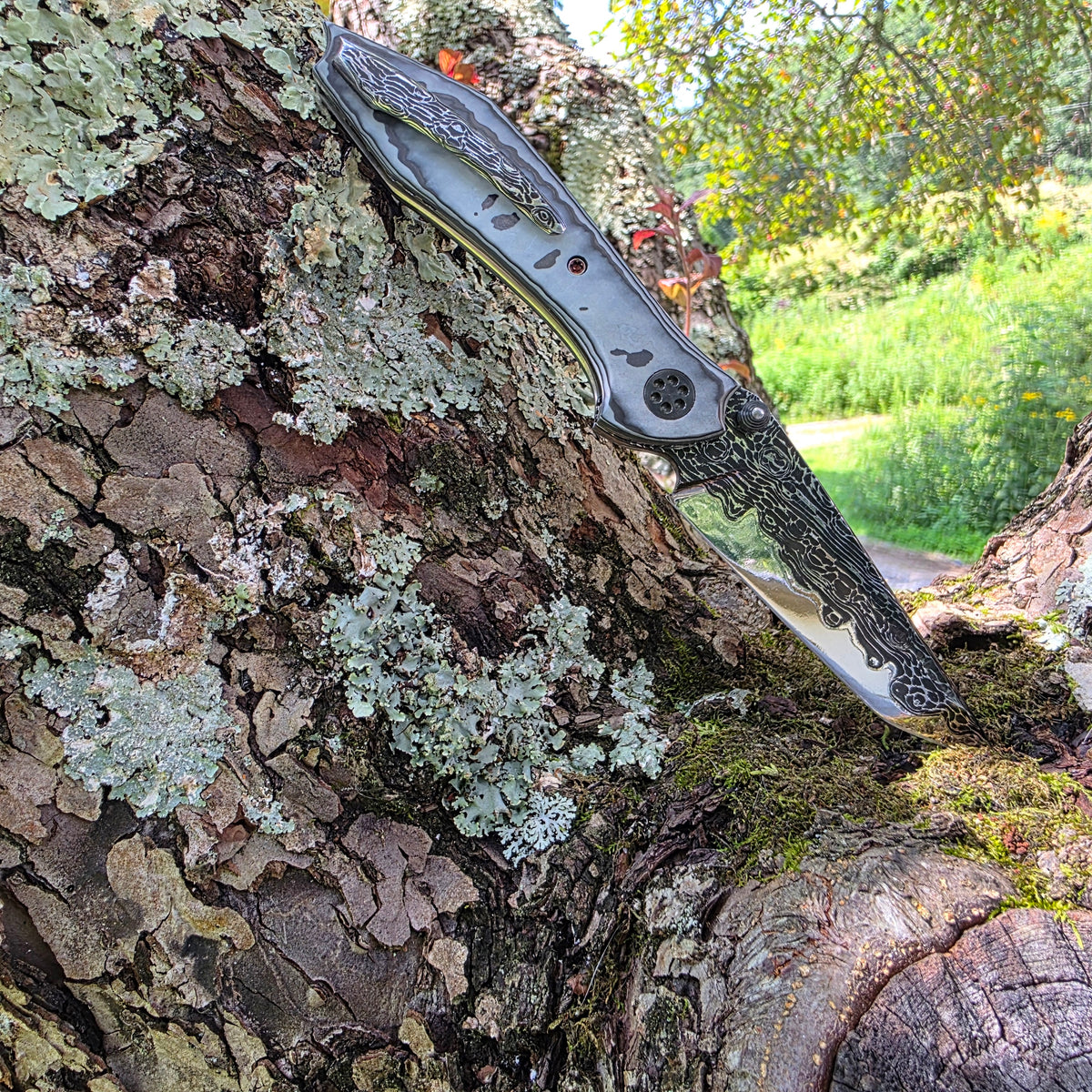 Larevo Customs Arris No. 2 custom folding knife, open on display